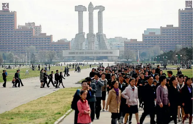  ?? PHOTO: REUTERS ?? People walk in front of the Monument to the Foundation of the Workers’ Party in Pyongyang, North Korea.