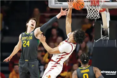  ?? AP Photo/Matthew Putney ?? ■ Baylor guard Matthew Mayer (24) pokes the ball away from Iowa State forward Robert Jones (12) during the second half of an NCAA basketball game Saturday in Ames, Iowa. Baylor won, 77-72.