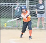  ??  ?? Tigers’ Kendall Biddle turns on a pitch in her wheelhouse.