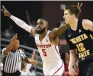  ?? ERIC CHRISTIAN SMITH — THE ASSOCIATED PRESS ?? Houston guard Corey Davis Jr. (5) reacts after making a basket during the second half of an NCAA college basketball game against Wichita State, Saturday in Houston. Houston won the game 73-59.