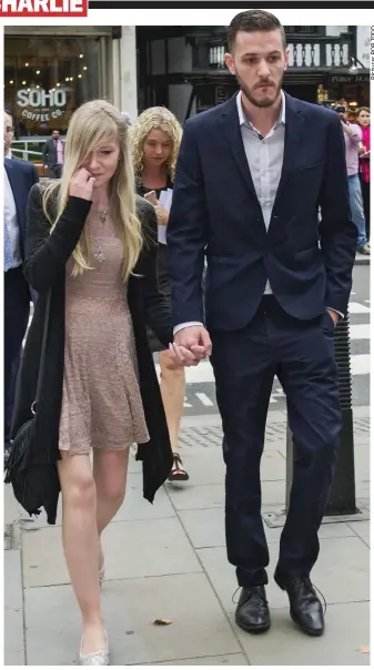  ??  ?? Hand in hand: Parents Connie Yates and Chris Gard at court yesterday