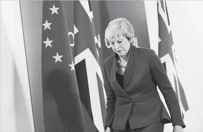  ?? SEAN GALLUP GETTY IMAGES ?? Britain’s Prime Minister Theresa May spoke at a press conference after a deal was struck to approve the nation’s withdrawal from the European Union. British MPs still must vote to approve the deal. Getting a majority may prove difficult.