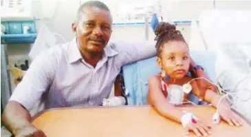  ??  ?? Mr. Achuama and his daughter after her operation