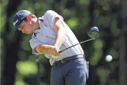  ?? STACY REVERE/GETTY IMAGES ?? J.T. Poston shot 9-under-par 62 on Thursday during the first round of the John Deere Classic at TPC Deere Run in Silvis, Illinois.