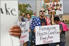  ?? Katharine Lotze/The Signal ?? Mike Stutz of Los Angeles chants along with other demonstrat­ors that gathered in front of Representa­tive Steve Knight’s Santa Clarita offices on Tuesday to voice their concerns over the GrahamCass­idy bill that would repeal the Affordable Care Act.