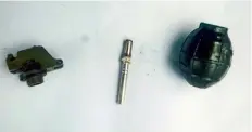  ??  ?? Parts of the grenade that went off (left) and the grenade that didn't go off (right)