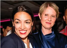  ??  ?? Progressiv­e challenger Alexandria Ocasio-Cortez, left, with New York gubernator­ial candidate Cynthia Nixon at her victory party in the Bronx