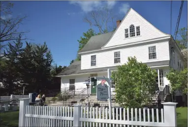  ?? Alexander Soule / Hearst Connecticu­t Media ?? Diners at the Po Cafe in early May 2021, adjacent to the U.S. Post Office in Washington, Conn., which services the 06793 ZIP code. The village led Connecticu­t ZIP codes for incoming movers in 2020 on a net basis, as reported on postal changes of address.