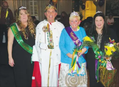  ?? Photo by Joseph B. Nadeau ?? In center, the King and Queen of Woonsocket Mardi Gras are Bob Billington and Joyce LaPerle. They were revealed Friday night at Savini’s Pomodoro. This year’s princesses are Kim Blais, at left, and Tammy Irwin, at right.