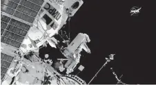  ?? NASA VIA AP ?? Cosmonaut Sergey Prokopyev flings a Sirius nano-satellite into orbit from the Internatio­nal Space Station on Wednesday.