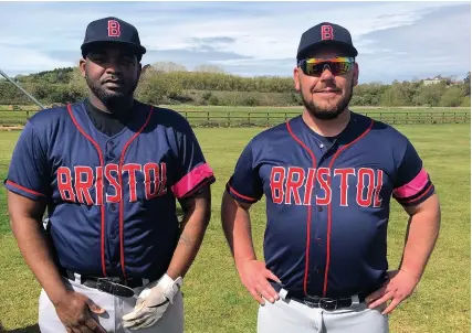  ??  ?? Carlson Charles and John Brownlee pictured wearing the pink armbands the Bristol Badgers wore on Sunday to promote women in baseball