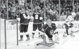  ?? Robert Gauthier Los Angeles Times ?? KINGS GOALIE Jonathan Quick, 32, gives up a goal in the second period to the San Jose Sharks as Jake Muzzin (6) and Drew Doughty (8) skate away.