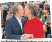  ?? PHOTO: JOEL C RYAN/INVISION/AP ?? Gary Oldman kisses wife Gisele Schmidt during a photo call at the 71st Cannes Film Festival in France