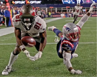  ?? MATT STONE / HERALD STAFF FILE ?? IN YOUR FACE: Jonathan Jones keeps Tampa Bay’s Antonio Brown from catching a touchdown pass during the fourth quarter Sunday night at Gillette Stadium.