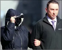  ??  ?? Covered up: Richards arrives at court with her husband, Paul