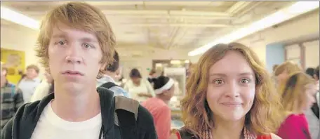  ?? Fox Searchligh­t ?? THOMAS MANN and Olivia Cooke in “Me and Earl and the Dying Girl,” written by Jesse Andrews and directed by Alfonso Gomez-Rejon.