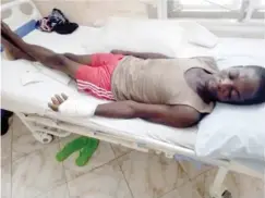  ?? ?? Usman Muhammad the farmer whose hand was cut now hospitalis­ed at a Gwagwalada hospital during a visit