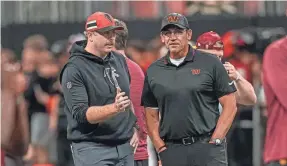  ?? DALE ZANINE/USA TODAY SPORTS ?? Arthur Smith, left, was 21-30 with the Falcons, while Ron Rivera was 26-40-1 with the Commanders.