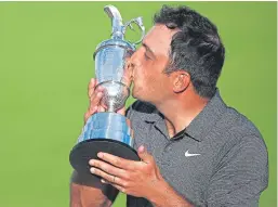  ??  ?? Francesco Molinari lifts the Claret Jug at Carnoustie.