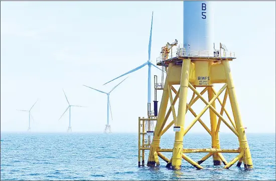  ??  ?? This June 12, 2017 file photo, shows five turbines of the Block Island, RI, Wind Farm. Specialist firms are growing fast as the shift away from fossil fuels introduces a raft of new variables. (AP)