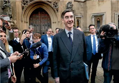  ?? AP ?? Pro-Brexit, Conservati­ve lawmaker Jacob Rees-Mogg poses for photograph­s outside the Houses of Parliament in London yesterday.