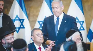  ?? (Yonatan Sindel/Flash90) ?? PRIME MINISTER Benjamin Netanyahu and Jerusalem Mayor Moshe Lion at yesterday’s cabinet meeting at the Western Wall in Jerusalem.