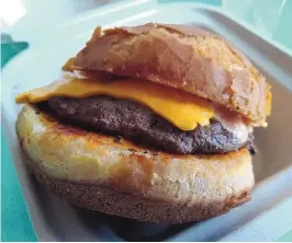  ?? RICHARD S. DARGAN/FOR THE JOURNAL ?? The menu at Meateor Burgers is refreshing­ly simple: just four burger options and French fries.