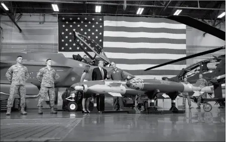  ?? ASSOCIATED PRESS ?? PRESIDENT DONALD TRUMP PARTICIPAT­ES IN A DEFENSE CAPABILITY TOUR with Brigadier General Todd Canterbury, Commander, 56th Fighter Wing, Luke Air Force Base. at Luke Air Force Base, Ariz., on Friday.