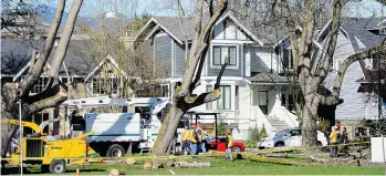  ?? MARK VAN MANEN/PNG ?? City crews and officials inspect the site after long-term arborist Jody Taylor, above left, was killed as he pruned a damaged Catalpa tree in Connaught Park at 10th and Vine in Vancouver on Thursday.