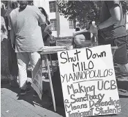  ?? THE ASSOCIATED PRESS ?? A group put up fliers and a booth on Sproul Plaza calling for protesters to “Shut Down Milo Yiannopoul­os,” at the University of California, Berkeley, campus in Berkeley, Calif.