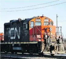  ?? GRAHAM HUGHES/THE CANADIAN PRESS FILES ?? CN Rail cited significan­t volume growth, combined with what it says was a difficult winter, for the plunge in its first-quarter net profit to $741 million.