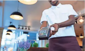  ?? GETTY IMAGES ?? Some restaurant owners believe having customers pay with a card makes their establishm­ent more efficient.