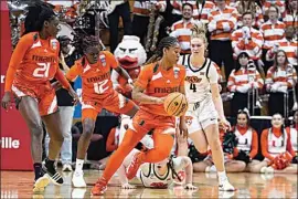  ?? DARRON CUMMINGS / AP ?? Miami’s Jasmyne Roberts (4) tracks down a loose ball during the second half of a first-round college basketball game against Oklahoma State in the women’s NCAA Tournament Saturday in Bloomingto­n, Ind.