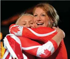  ?? MATHEW MCCARTHY/THE CANADIAN PRESS ?? Kaillie Humphries and Heather Moyse, right, won their first gold medal together in Vancouver eight years ago. They’re in different sleds this time.