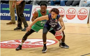  ?? PHOTOSPORT ?? Manawatu¯ Jets guard Daishon Knight, left, tries to shut down Dontae RussoNance of the Auckland Huskies on Friday night.