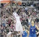  ?? STEVE CANNON/AP ?? Jonathan Isaac slams the ball through against Duke’s Chase Jeter in a game earlier this season. He had a double-double in FSU’s loss on Saturday to North Carolina.