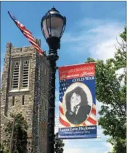  ?? MEDIANEWS GROUP FILE PHOTO ?? A banner on Main Street in Lansdale features Laura Love Heckman, who served in the Unites States Navy during the Cold War era.