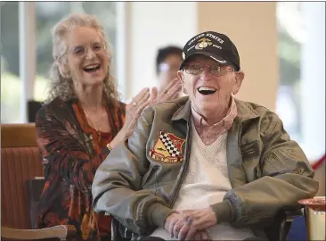  ?? PHOTOS BY JOEL ROSENBAUM / THE REPORTER ?? With daughter Nancy Dunn seated next to him, Warren MacQuarrie, 100, reacts as he listens to a letter from the Commandant of the United States Marine Corp., Gen. David H. Berger, read during a celebratio­n honoring him on his birthday Wednesday at Paradise Valley Estates in Fairfield. McQuarrie is a retired colonel from the Marine Corps who served in World War II and the Korean and Vietnam wars. The letter was a gift from his family.