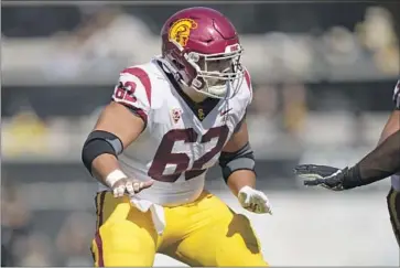  ?? David Zalubowski Associated Press ?? OFFENSIVE LINEMAN Brett Neilon, who had dozens of offers coming out of Santa Margarita High, learned his strong work ethic as a boy in Japan. He brought it to USC, where he leads his team on and off the field.