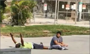  ?? VIDEO SCREEN CAPTURE ?? In this screen capture from video, Charles Kinsey seen with a patient before being shot by police.