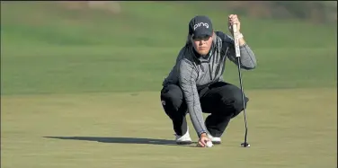  ?? Patrick Smith / Getty Images ?? Jennifer Kupcho lines up a putt on the 15th green during the second round of the Women’s PGA Championsh­ip at Aronimink Golf Club on Friday in Newton Square, Pa.