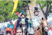  ?? EDDIE MOORE/JOURNAL ?? Danny Diaz, left, playing Don Diego de Vargas, his brother Francisco Diaz Jr., right, and members of the Fiesta Court take part in 2016’s Entrada.