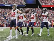  ?? JIM ROGASH / GETTY IMAGES ?? Texans safety Tyrann Mathieu celebrates after intercepti­ng Tom Brady in the first quarter of the opening loss to the Patriots. Mathieu also recovered a fumble in his first game with Houston.