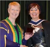  ??  ?? Prize Winner....Caroline McGee, Prize Winner receives the Bachelor of Business iStudies (Hons) medal from Ann Campbell, President at the Conferring of Awards held in DkIT.