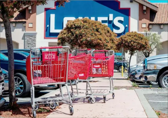  ?? David Paul Morris/Bloomberg ?? Lowe’s cut its sales outlook a week after Home Depot, blaming falling lumber prices, unfavorabl­e weather and lower spending on do-it-yourself projects and other discretion­ary items for declining sales.