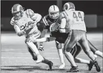  ??  ?? LCI Rams’ Jack Halvorson runs the ball toward the goal line for a touchdown against the Catholic Central Cougars during Southern Alberta High School Football League action Friday night at the University of Lethbridge Stadium. The Ram won 45-13. In...