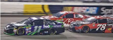  ??  ?? Denny Hamlin leads Kyle Larson and Martin Truex Jr. during the NASCAR Sprint Cup race at Richmond Internatio­nal Raceway in Richmond, Va., Saturday. All three may be strong contenders in the Chase for the Championsh­ip.