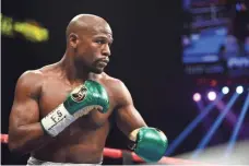  ?? JOE CAMPOREALE, USA TODAY SPORTS ?? Earnings from the Aug. 26 fight with Conor McGregor could potentiall­y net Floyd Mayweather Jr., above, nine figures.