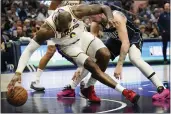  ?? LM OTERO — THE ASSOCIATED PRESS ?? Los Angeles Lakers forward LeBron James, left, reaches for the ball against Dallas Mavericks guard Luka Doncic, right, during the second half in Dallas on Sunday.