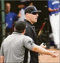  ?? Pete Paguaga / Hearst Connecticu­t Media ?? Southingto­n coach Stan Switala talks to the umpire during the Class LL championsh­ip game against Fairfield Warde on Saturday.